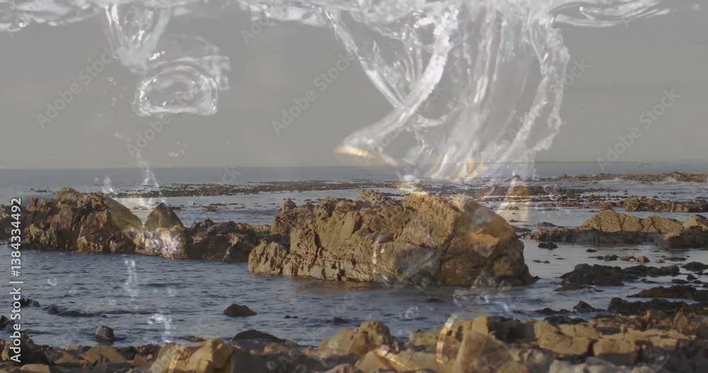 Aufkleber crashing waves over rocky shoreline with splashes and bubbles in animation motion