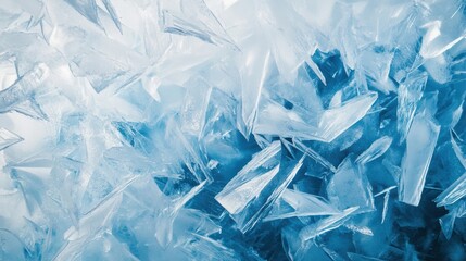 Obraz premium Frozen ice crystals display delicate patterns in a soft blue-white gradient showcasing winter minimalism
