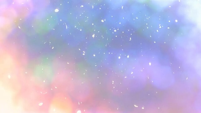 淡いパステルカラーのキラキラした光の丸ボケの背景　ひらひら舞い散る花びら　季節・春のイメージ