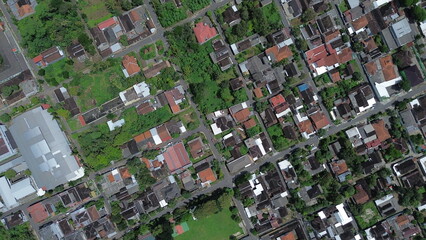 Aerial View of Indonesian Village with Traditional Rooftops