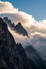 Fototapeta premium mountains with a few clouds in the sky and a person on a horse