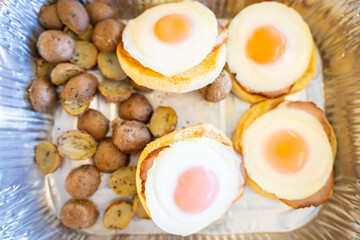 Eggs Benedicts with grilled potatoes for breakfast
