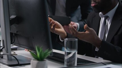 African American Caucasian men coworkers colleagues multiethnic males diversity guys businessmen business in office working computer digital tablet solve problem pc corporate teamwork talk discussing