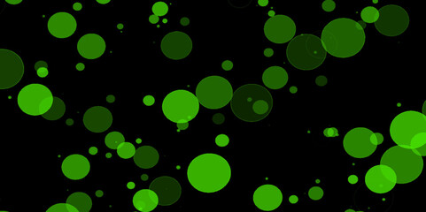 Unfocused abstract colorful bokeh black background. Festive background, background for a holiday card. Green Defocused Lights. Defocused green lights on dark background. 