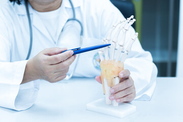 Orthopedist explain to the patient for human hand and fingers bone injury treatment program.Doctor...