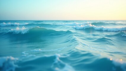 A tranquil ocean background with gentle waves in shades of turquoise and deep blue, soft foam textures