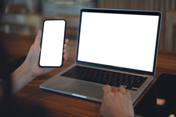 Mockup blank white screen mobile phone. Woman hand holding, using smartphone, online working on...