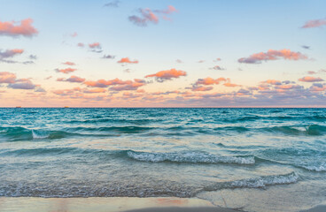 Sunrise with sea beach. Dramatic sunrise horizon at sea. Romantic summer vacation on sunset...
