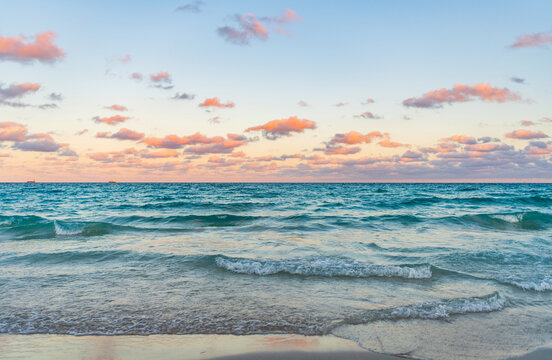 Sunrise with sea beach. Dramatic sunrise horizon at sea. Romantic summer vacation on sunset seascape. Sea sunset on ocean. Sunset seascape at summer vacation