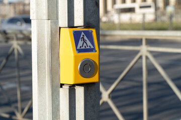 Pedestrian zebra crossing with telling people to wait for appropriate signal and push the button. A...
