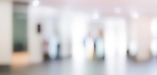 Soft-focus image of a well-lit office interior. Modern blurred photo of office space with bright and clean light.