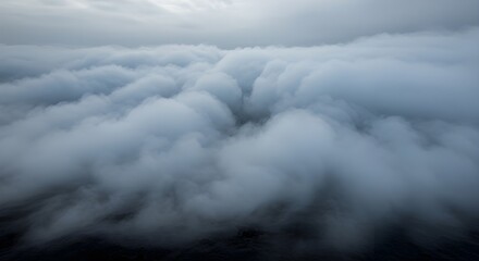 Obraz premium Dramatic Aerial View Flying Above a Thick Layer of White Clouds Under a Cloudy Grey Sky