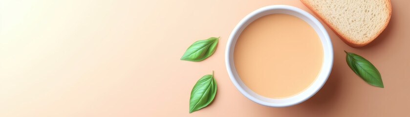 delicious plant based recipe featuring creamy soup served with slice of bread and fresh leaves, perfect for healthy meal