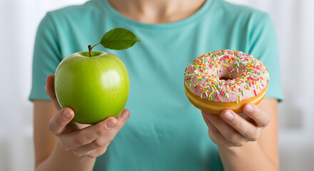 Woman Hands Presenting Green Apple and Colorful Donut as a Healthy Versus Unhealthy Snack Choice in Bright Studio Light