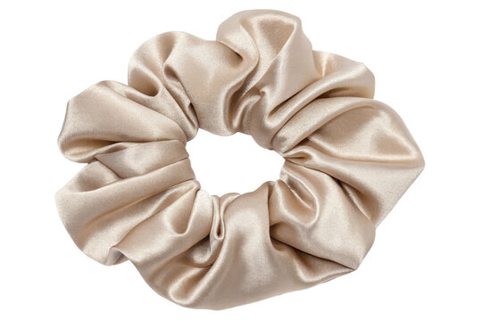 Satin hair scrunchie in an elegant neutral color isolated with transparent background