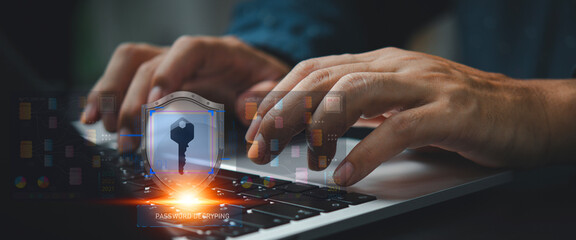 Data Security in Action: Hands expertly navigate a laptop keyboard, a digital shield of security...