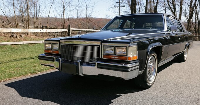 Cadillac Brougham vintage car on the road