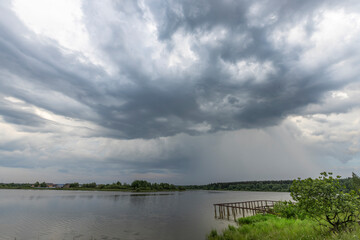 A stormy sky with a lake in the background
