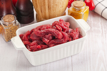 Raw beef meat - sliced strips