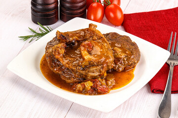 Italian cuisine - ossobuco with sauce