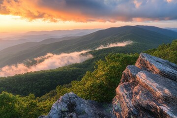 A majestic mountain summit illuminated by golden hour light with misty valleys and a pastel sunset in a panoramic vista
