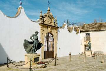 Ronda, Andalusia, Spain - The entrance to the bullring with the statue of the bullfighter Cayetano Ordóñez