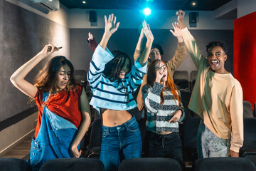 Young people dancing and enjoying music at movie disco event