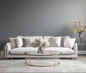 Modern living room featuring a neutral color palette, a comfortable sofa, and a round coffee table.  Soft lighting and a touch of nature through a decorative arrangement add to the calming ambiance