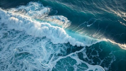 Top view of ocean waves with white foam