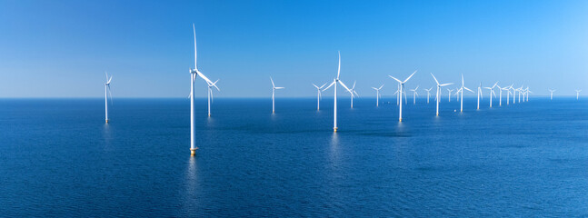Expansive offshore wind turbine park located in the Netherlands, showcasing numerous towering...