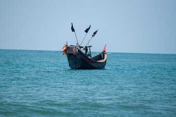 Fototapeta premium Traditional colorful wooden fishing boats on the Coast of Saint Martin’s Island, Bangladesh.