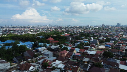 Aerial view of the city with many buildings and housing