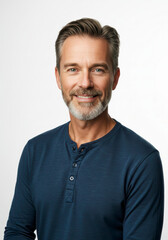 Obraz premium Confident mid adult man in a sharp suit smiling brightly against a clean white background