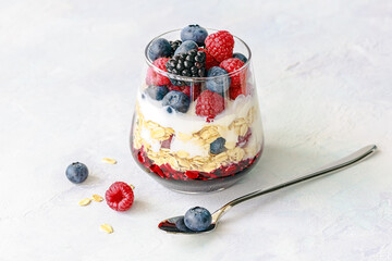 Fresh Berry Parfait with Yogurt and Granola in Glass