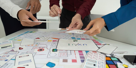 Team Meeting and Design Planning. Designers brainstorming ideas for a user-friendly interface.