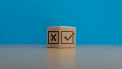 Selection or check, wrong and right marks on wooden blocks