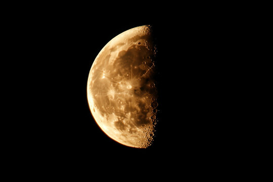 Half moon shining in the dark night sky