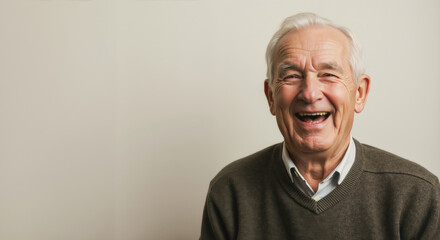 Enthusiastic senior man laughing with genuine joy. Active aging and happiness in retirement concept