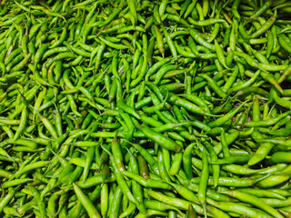 Chili peppers, also spelled chile or chilli (from Classical Nahuatl chilli), are varieties of berry-fruit plants from the genus Capsicum, fresh green chillies, red cayenne, Birds eye chilli.