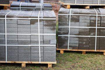 Bricks are carefully stacked on sturdy wooden pallets for transport