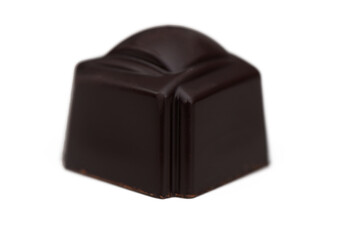 Exquisite dark chocolate truffle crafted with precision and elegance, showcasing a rich and glossy finish, perfect for connoisseurs of fine sweets