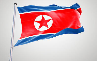 Flags of north korea waving in the wind with patriotic symbols and colors representing their nations