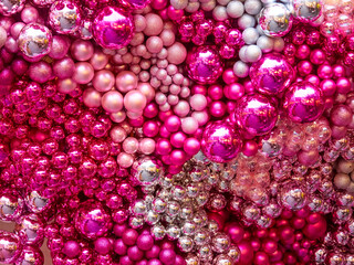 Christmas Texture or background of bright pink balls. Greeting or postcard