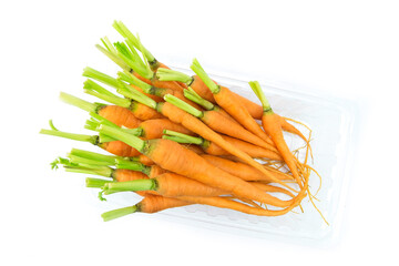 carrots on a white background, Top view of fresh baby carrots in clear plastic container isolated...