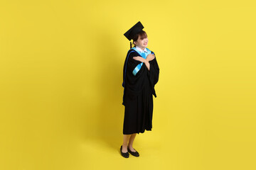 20s woman in Graduation gown