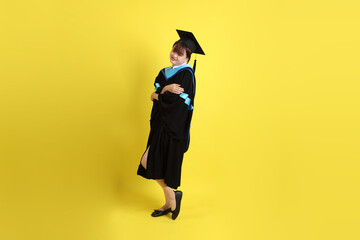 20s woman in Graduation gown