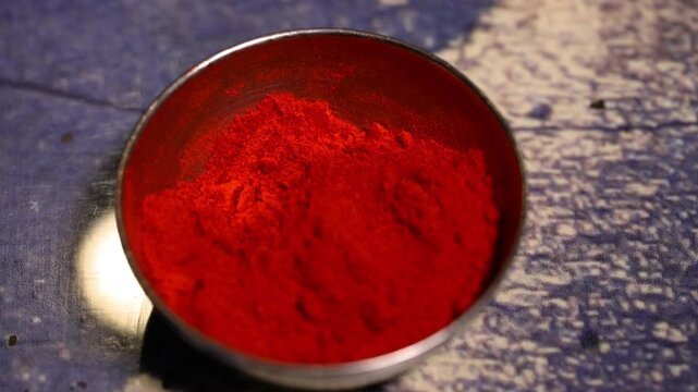 Closeup shot of red chilli powder in bowl.