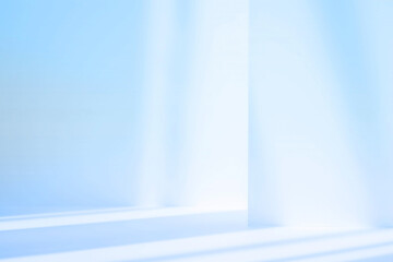 Abstract blue studio background for product presentation. Empty room with shadows of window. Display product with blurred backdrop.