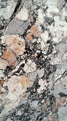 Fototapeta premium Closeup of rough granite texture with black white and gray speckles