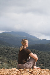woman  in the mountains, embracing slow living and mindfulness. A moment of balance, self-care, and...